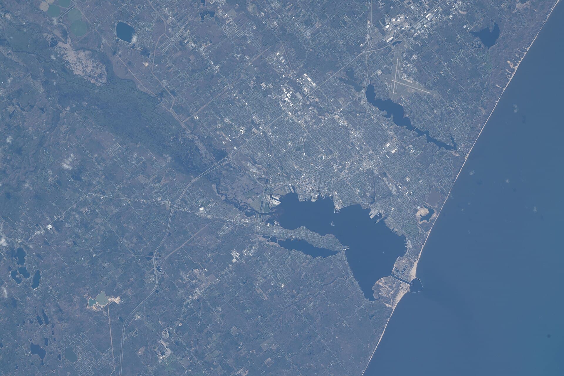 Aerial view from the ISS of Muskegon Lake meeting Lake Michigan through the Muskegon channel